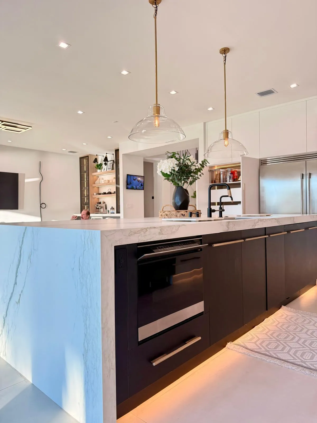 Built-in under-counter convection microwave drawer integrated into custom kitchen cabinetry, featuring convection cooking and an air fry function for added versatility.