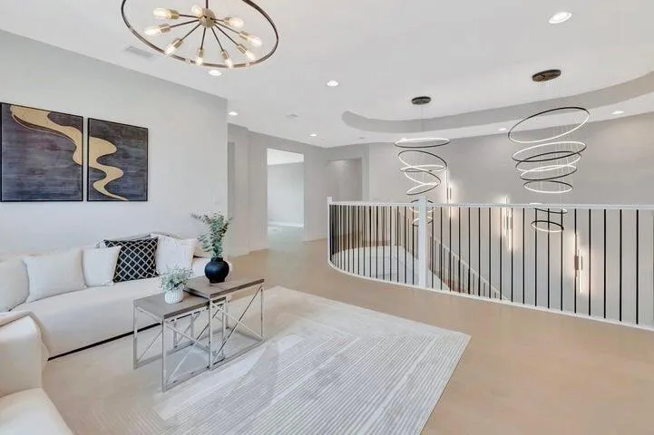 Open loft space overlooking the main living area, ideal for a media room, office, or additional lounge space.