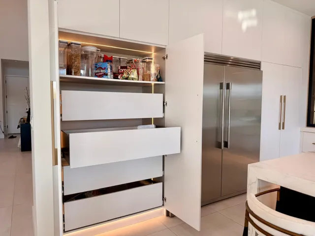Thoughtfully designed deep drawers and built-in storage maximizing functionality while maintaining a sleek, minimalist look.