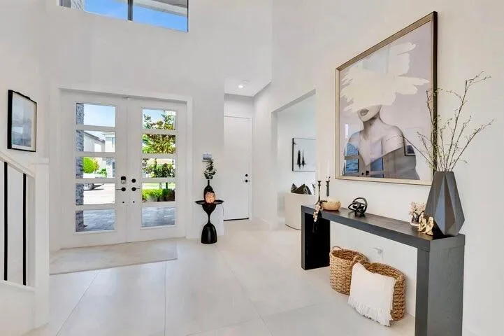 Alternate view highlighting the foyer’s open layout and architectural details.