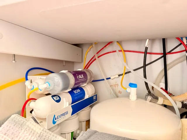 Dedicated under-sink water filtration system providing filtered water directly at the kitchen sink.