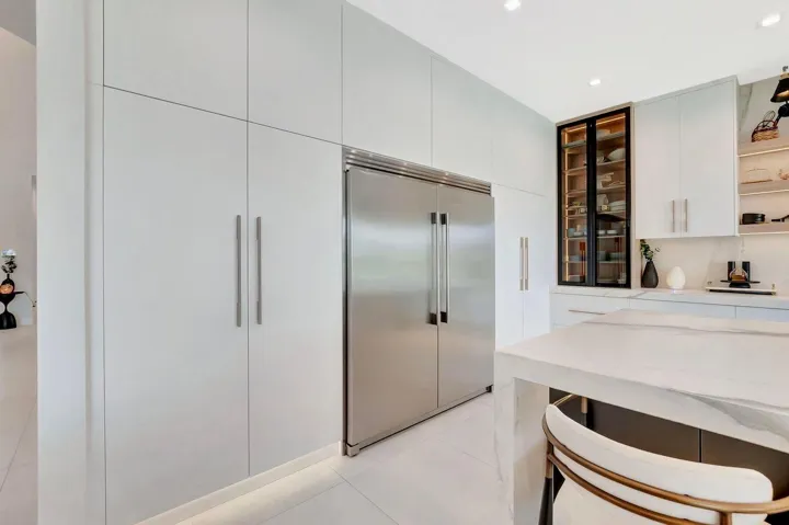 Seamlessly integrated refrigeration and custom cabinetry designed for a clean, modern aesthetic and efficient workflow.