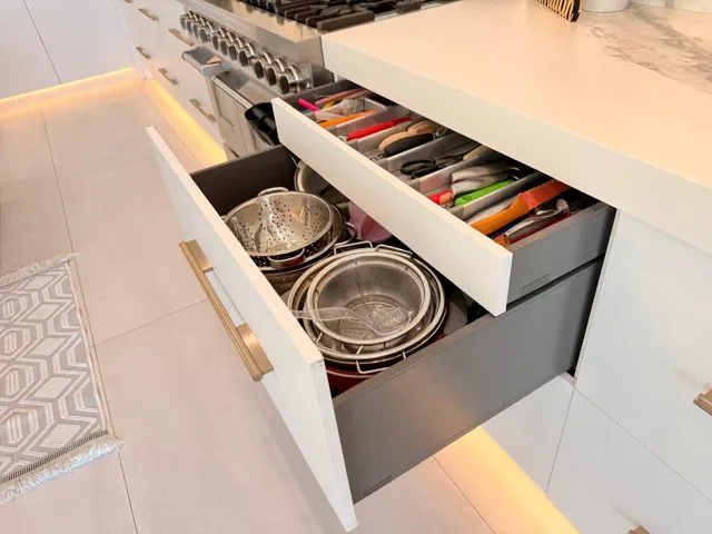 Smartly designed deep drawers and custom storage solutions maximizing function without sacrificing style.