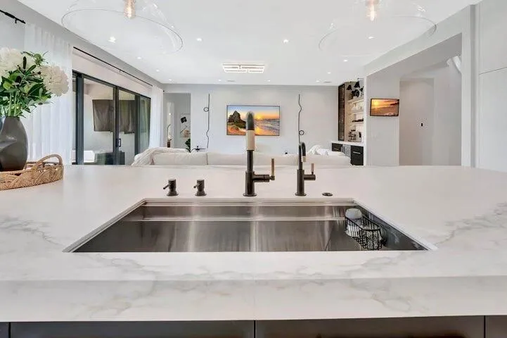 Alternate view of the custom sink with porcelain cover panels removed, revealing the full sink basin and functional design beneath.