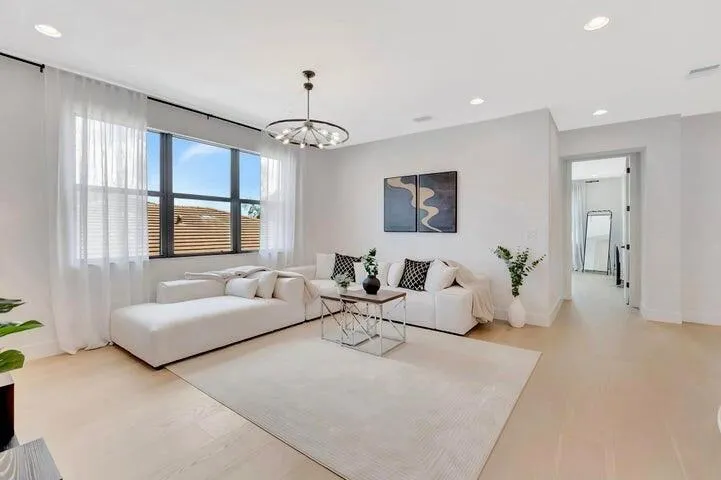 Wide-angle view of the upper-level loft emphasizing ceiling height, openness, and flexible use options.
