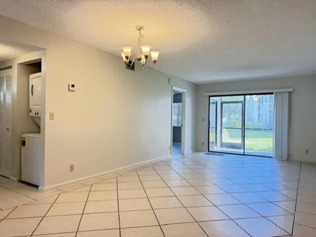 DINING AND LIVING AREA WITH VIEW OF LAKE AND GARDEN