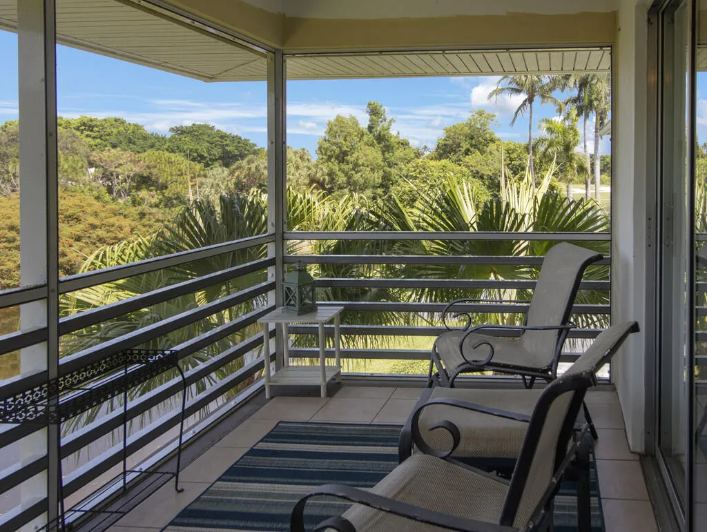 Screened lanai overlooking water and golf course.