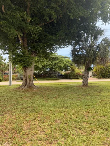 Expansive green lawn with established trees - Pie shaped lot with 20 feet on Water