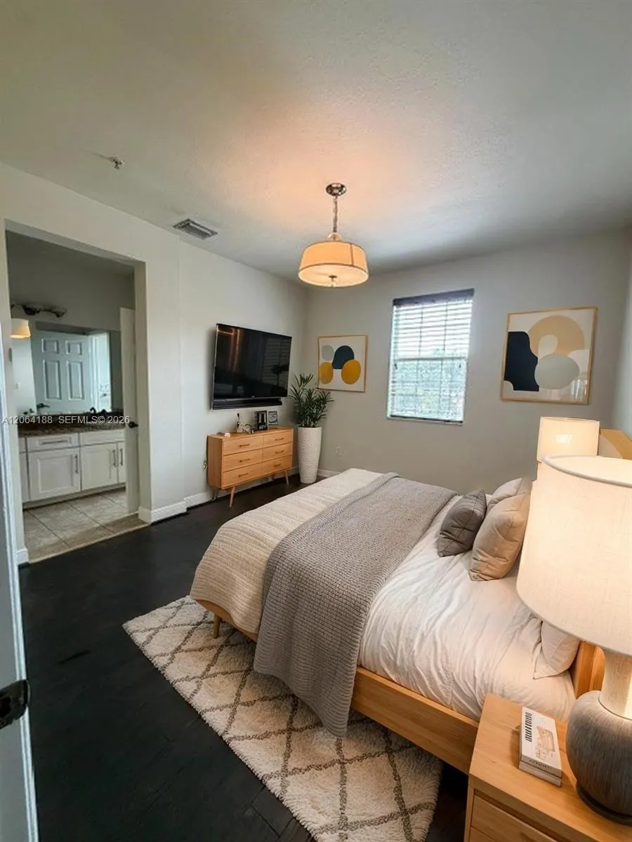 3rd bedroom with private full bath, on main level. VIRTUALLY STAGED