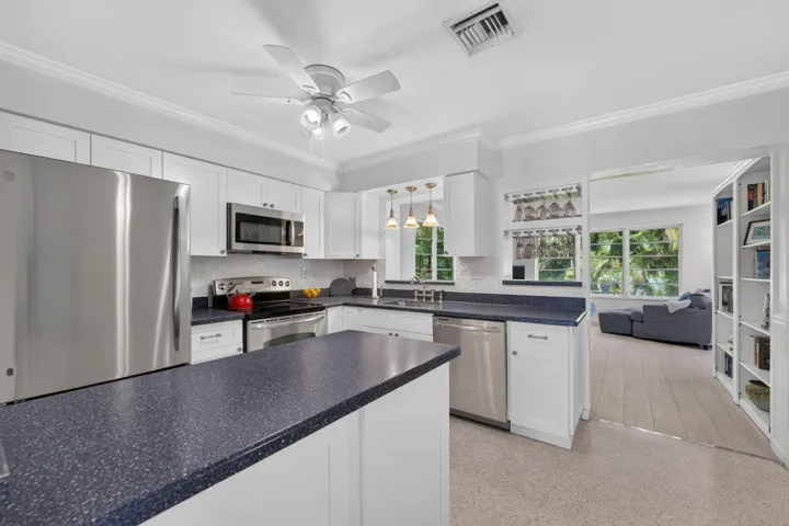 Opens to Dining and Family Rooms