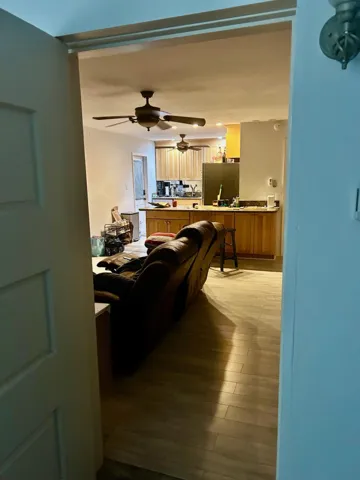 Unit A Living Area with Recliner Seating & Adjacent Kitchenette