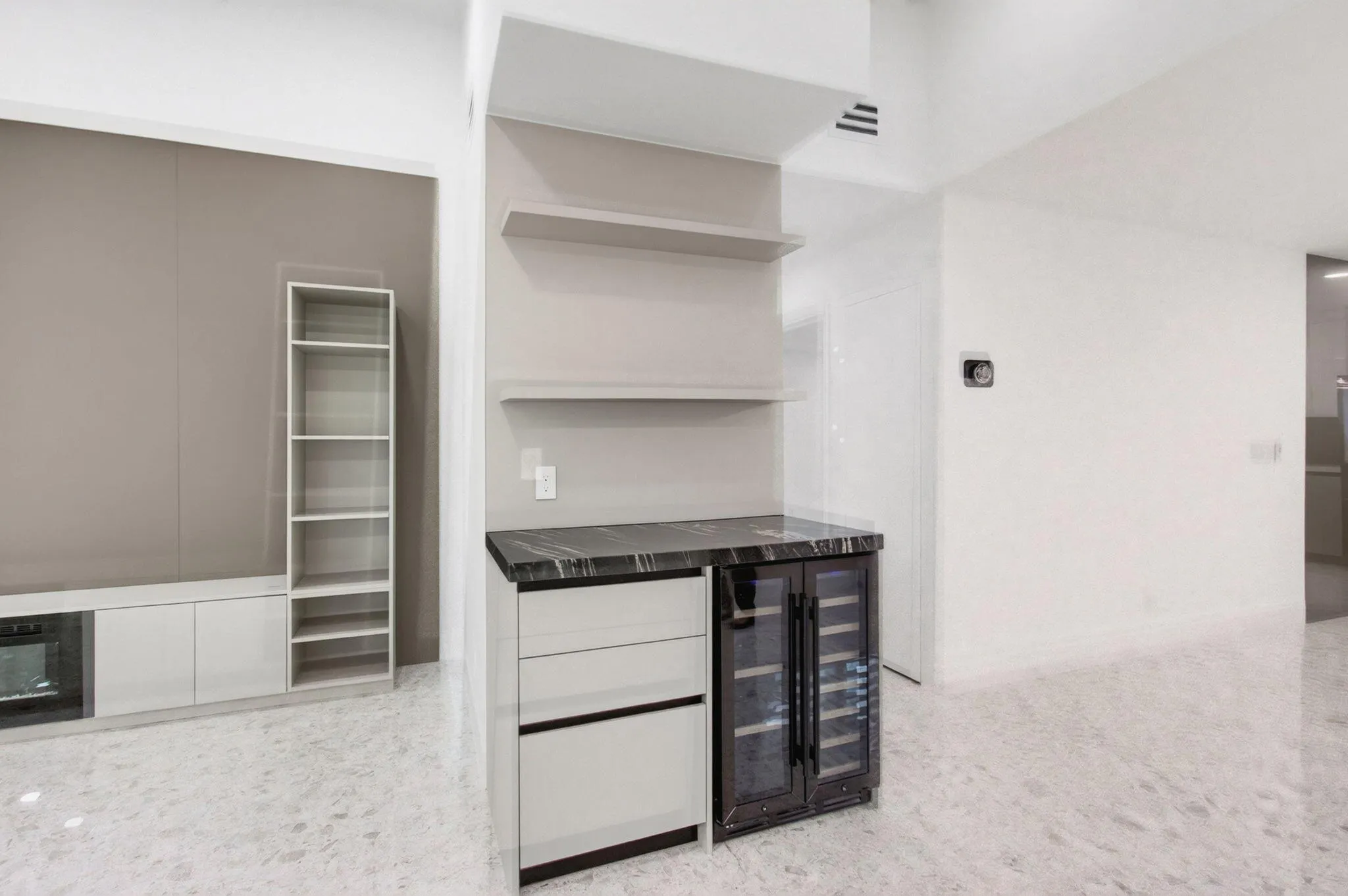 Entertainment center bar area and living room with shelving