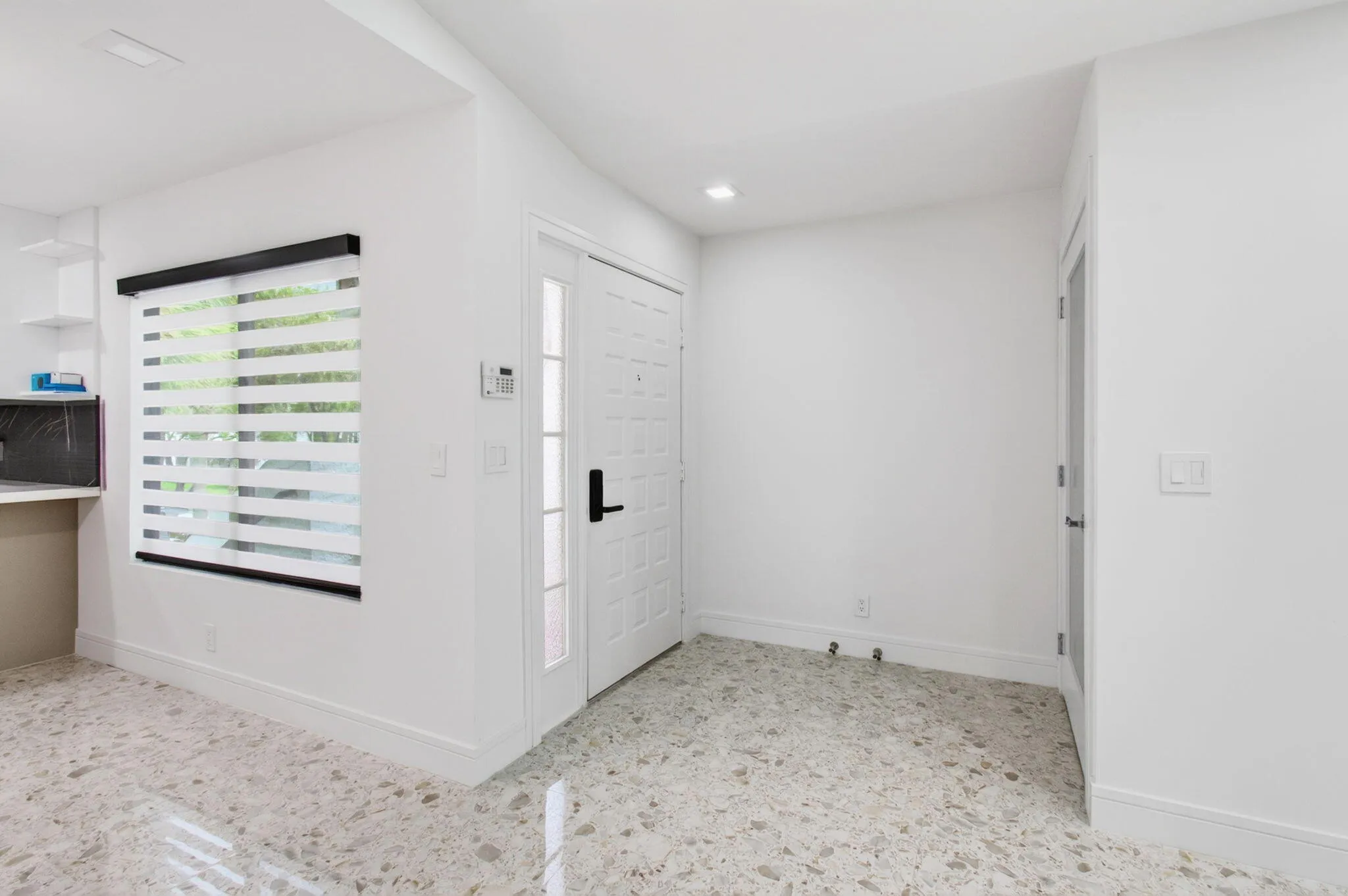 Inside front door on left and closet on right