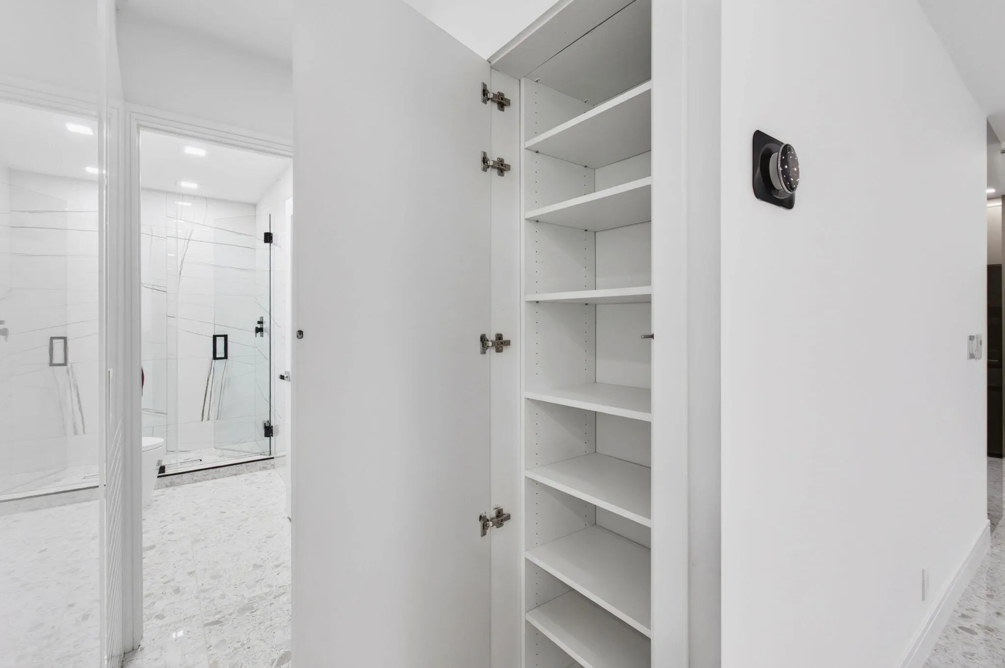 Extra closet in walkway outside guest bedroom