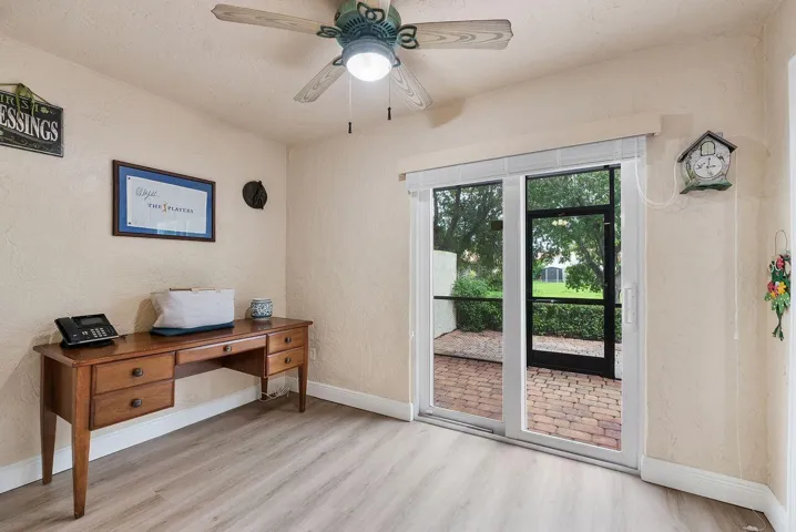 Office/Bonus Room located downstairs off patio with sliding doors and access to adjacent living room with barn door