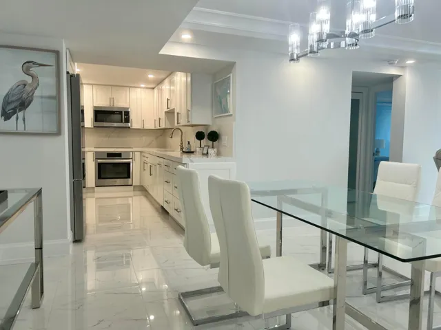 Modern kitchen featuring white cabinetry, stainless steel appliances renovated in 2025