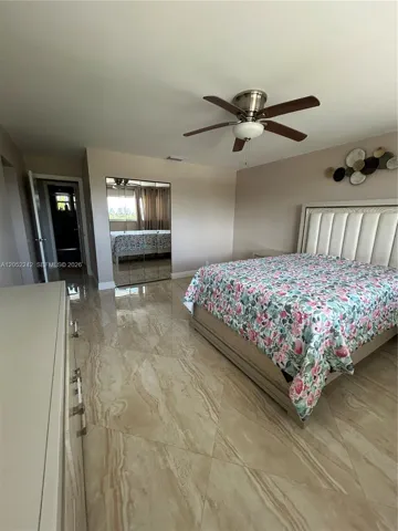 windows across width of room showing views of Hallandale and Miami