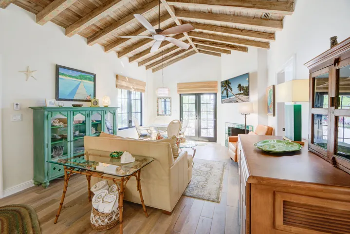 Vaulted wood-beam ceiling with an overhead fan