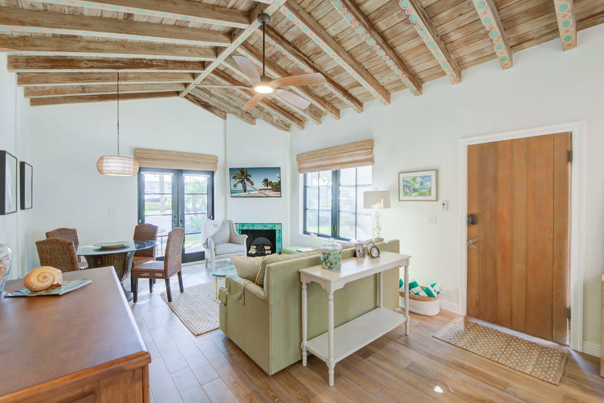 Vaulted wood-beamed ceiling with an integrated ceiling fan