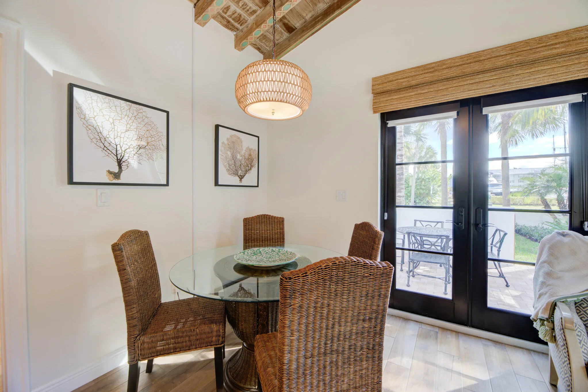 Dining area featuring wood-finish flooring and a textured ceiling