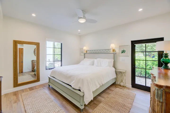 Bedroom featuring wood-finish flooring, recessed lighting, and a ceiling fan