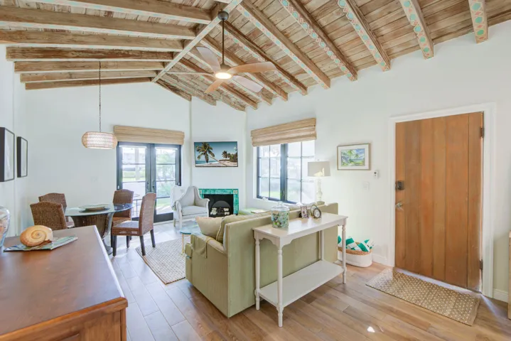 Vaulted wood-beamed ceiling with an integrated ceiling fan