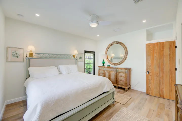 Bright interior space featuring wood-finish flooring, recessed lighting, and a ceiling fan