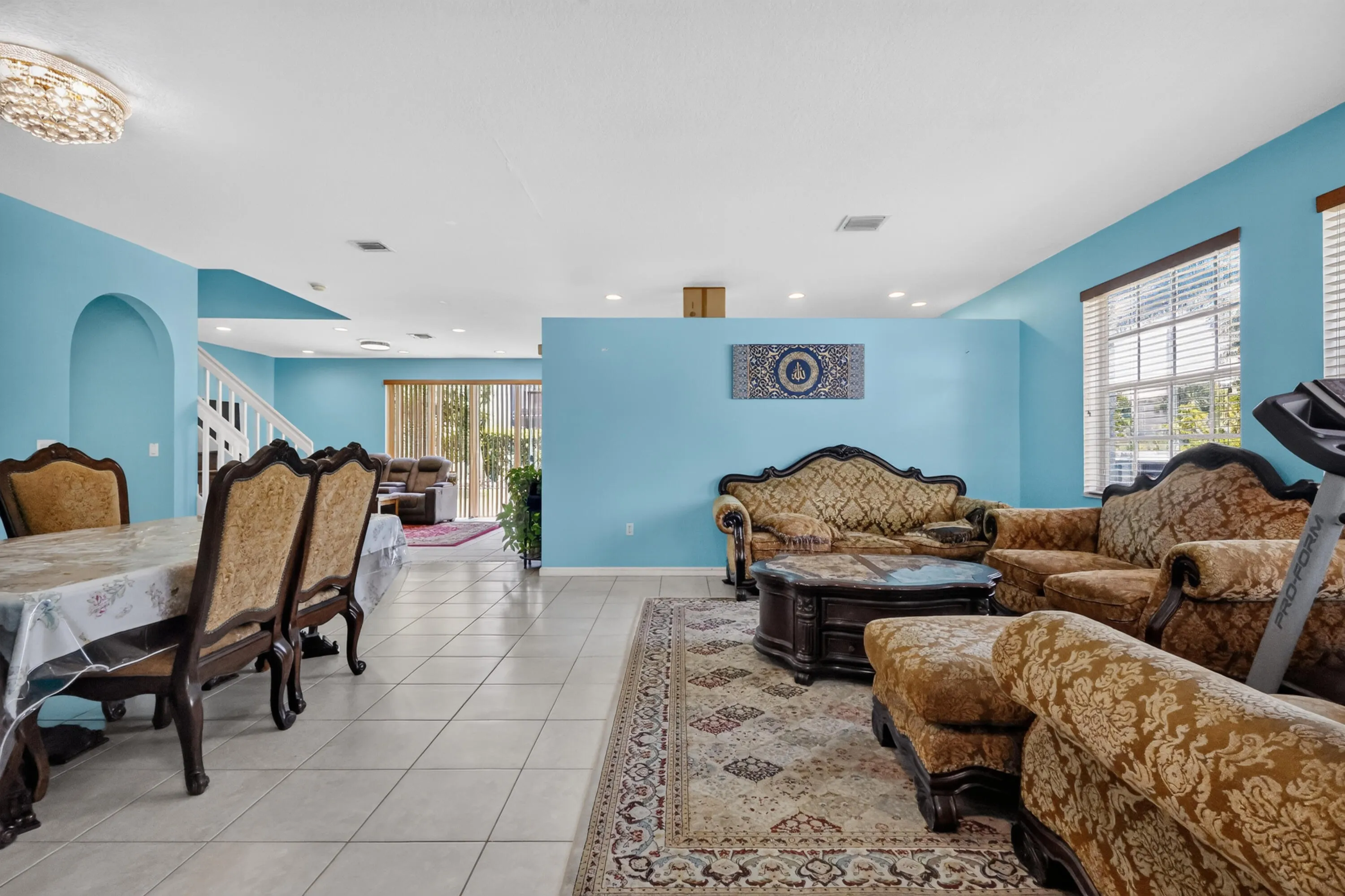 Expansive interior with light blue walls and tile flooring