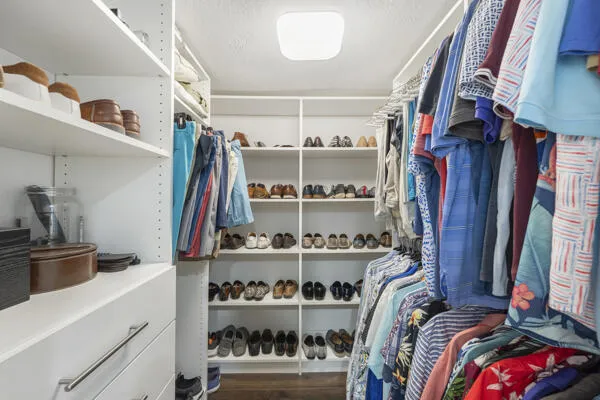 Walk-In Closet with Custom Built-ins.