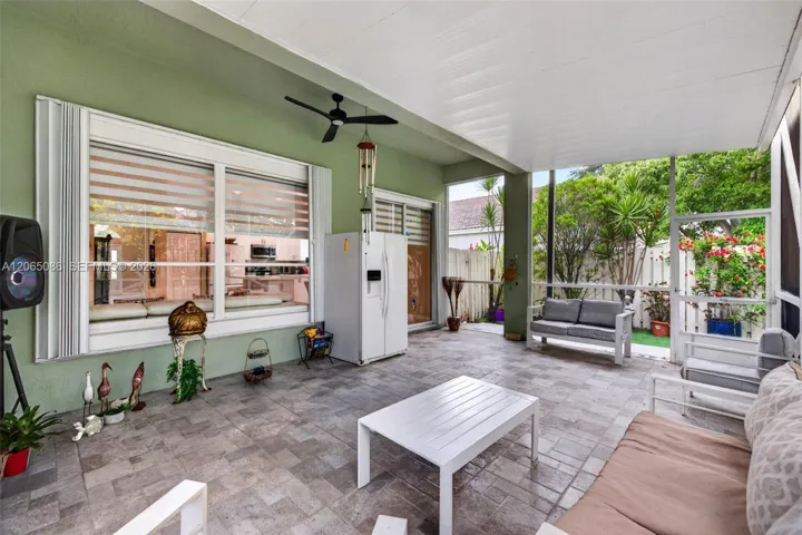 Step outside to your large, fully tiled, screened-in patio with a covered overhang overlooking a fully fenced backyard with mature fruit trees, astroturf and a Rain Bird irrigation system.