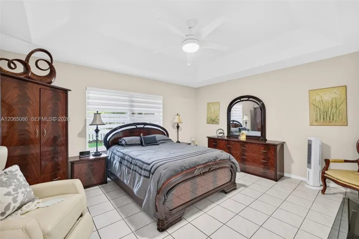Tiled Primary Bedroom w/ Motorized Shade