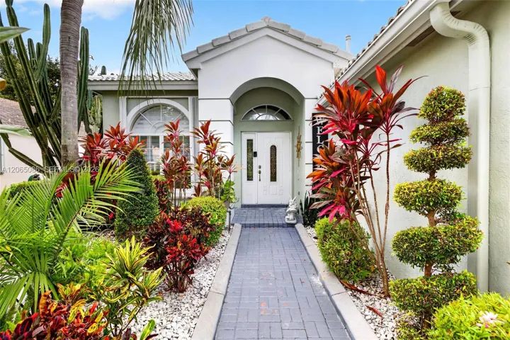 Beautiful entry w/ lovely landscaping