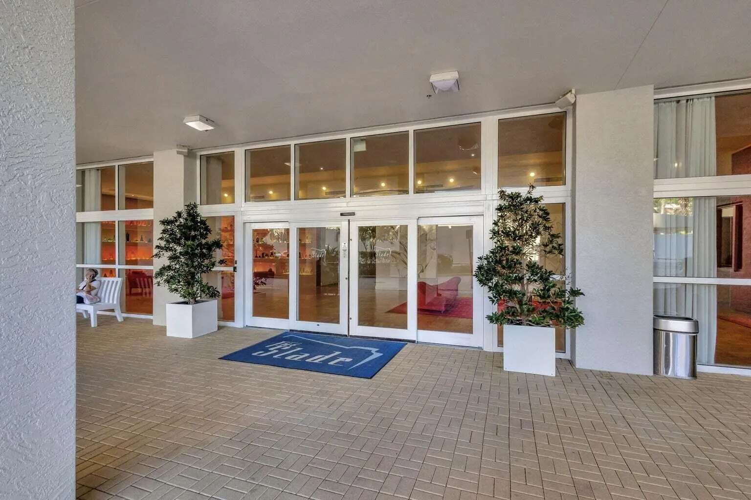 Entryway featuring expansive glass doors, surrounding windows, and recessed lighting