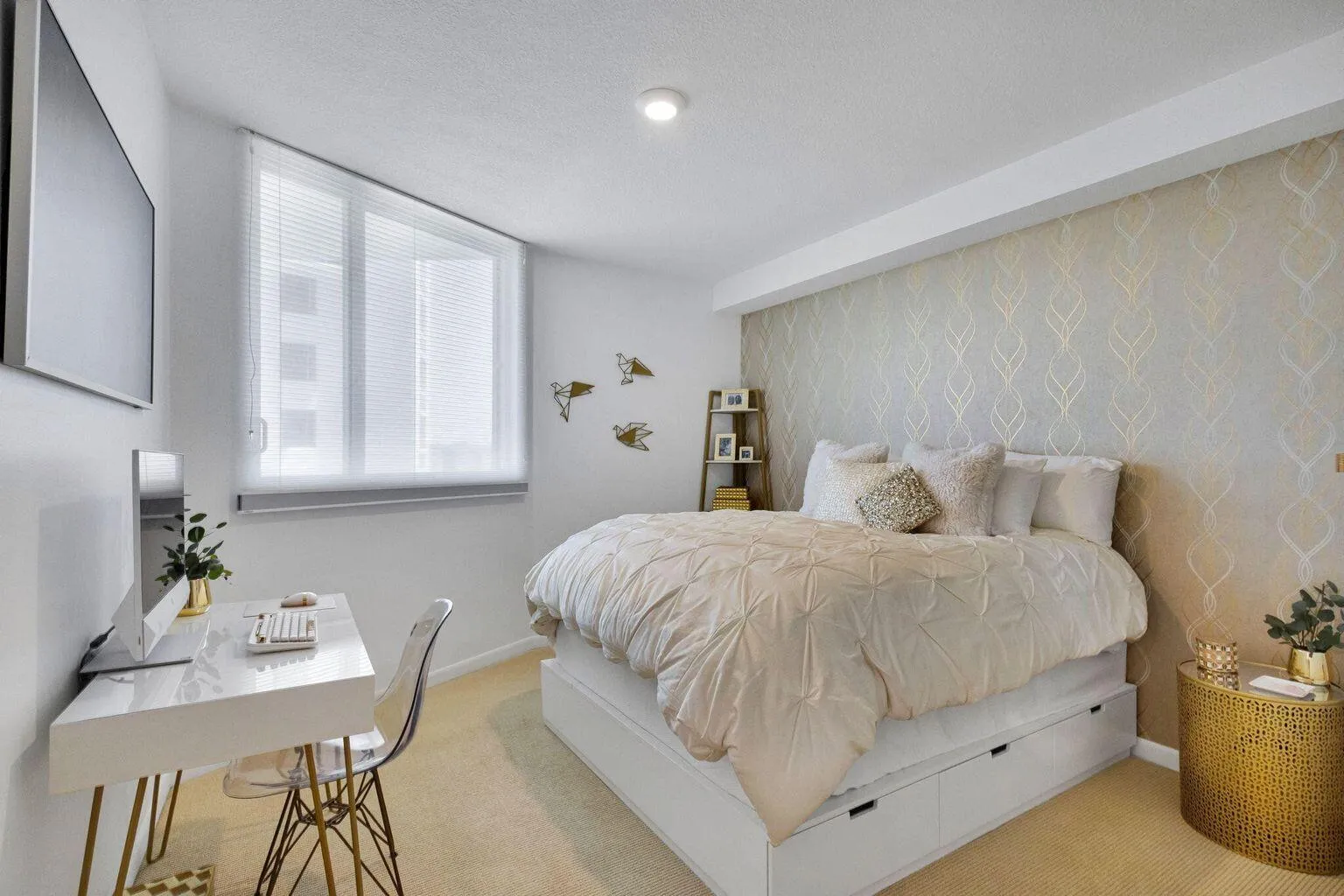 Bedroom featuring a patterned accent wall, light beige carpeting, and a window with horizontal blinds