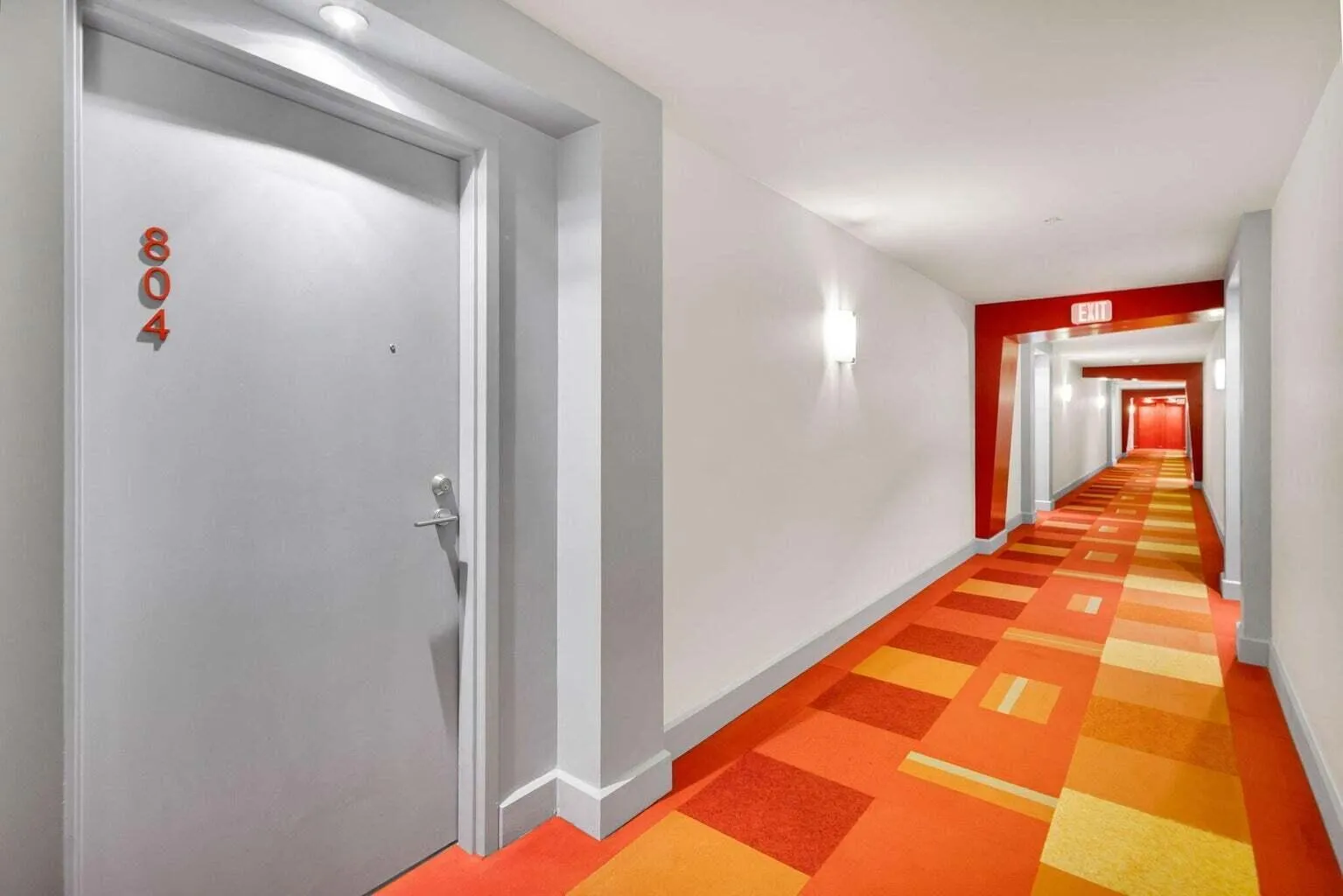 Entry door featuring modern hardware and recessed lighting