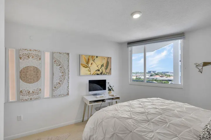 Bedroom featuring a large window, recessed lighting, and carpeted flooring