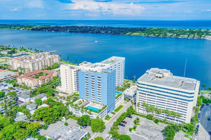 Aerial perspective showcasing waterfront properties with abundant natural light