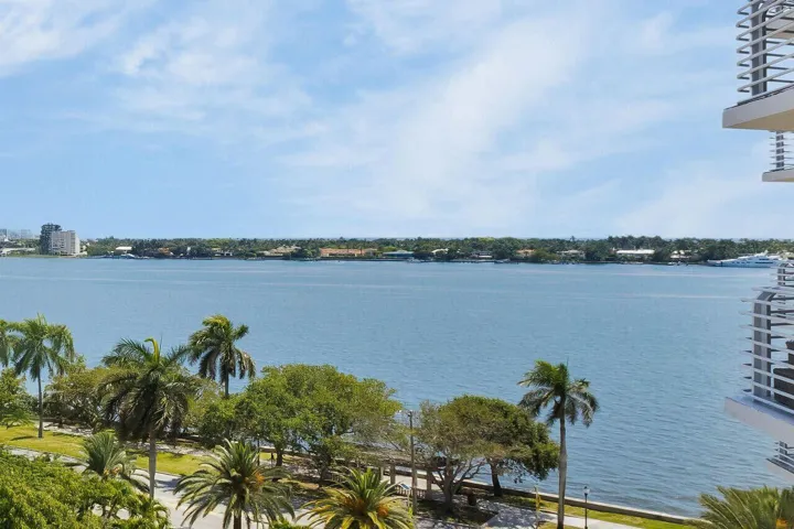 Expansive water frontage with a distant cityscape