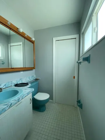 Half bath off of main bedroom. Pocket door to shower
