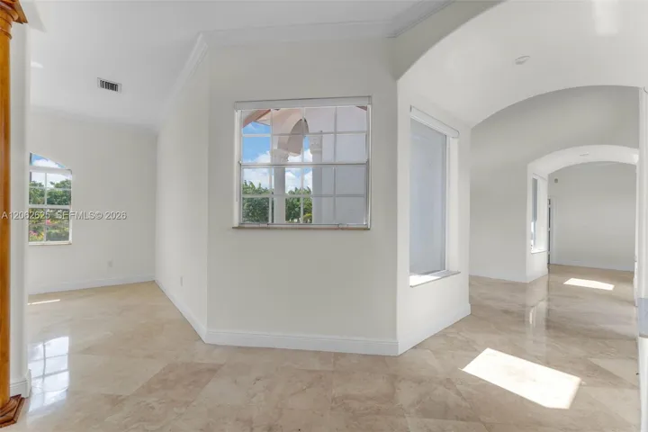 FOYER OPENS TO COURTYARD VIEW THEN ALL WRAPS AROUND AMAZING COURTYARD. THE LIVING AREAS ON ONE SIDE WITH BEDROOMS ON ANOTHER...