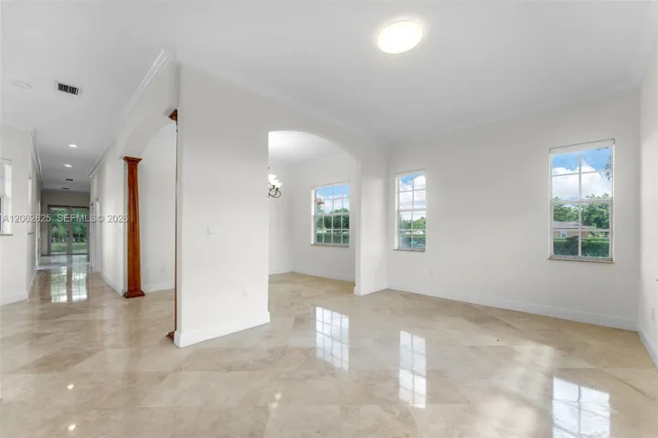 VIEW OF REAR DOOR OFF KITCHEN/PLUS..LIVING AND DINING ROOM.