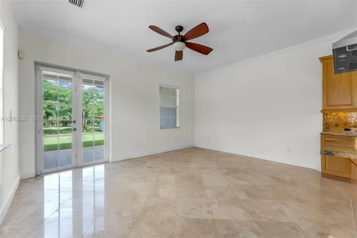 BEEN USED AS MEDIA ITS OFF KITCHEN THAT OPENS TO REAR DOORS WITH WALKWAY TO CARPORT OR COURTYARD..