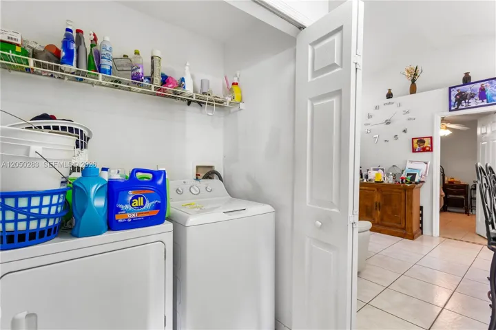 Master entry HALLWAY with the IN-RESIDENCE LAUNDRY AREA conveniently tucked away