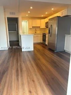 View from your front door - Notice the recessed lighting in the kitchen