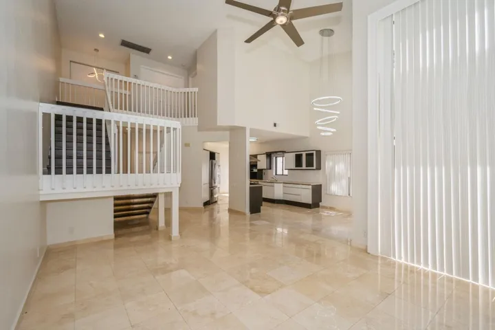 08_5504FoxHollowDr_93_LivingRoomDiningRo
