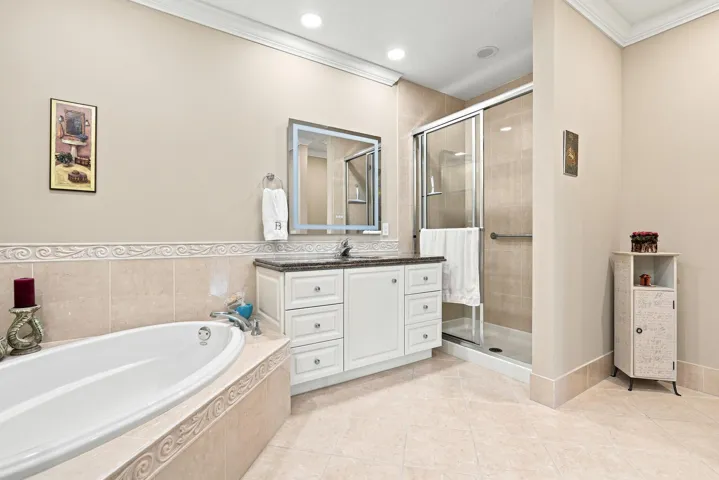 Another view of primary bath. Another custom feature is that multiple switches have been installed to control lights and fan separately (many do not have this).