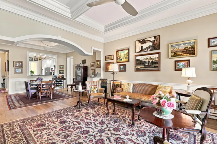 The custom archway creates thoughtful separation between the living and dining areas.