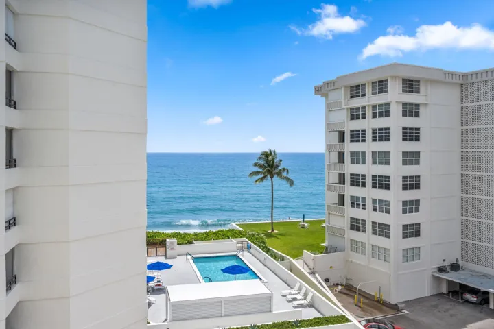 Oceanfront resort-style living featuring a sparkling heated swimming pool