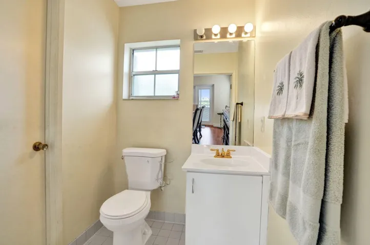 HALF BATH DOWNSTAIR WITH A STORAGE ROOM IN THERE