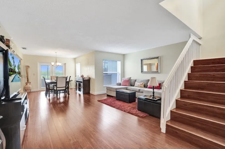 THE HOME HAS ALL WOOD FLOORING LOTS OF WINDOWS